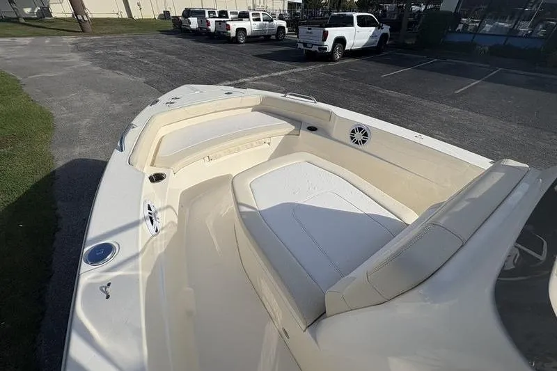 Slide: The Image of 2026 Scout 188 Sportfish boat interior with cushioned seating and speaker system. - 23