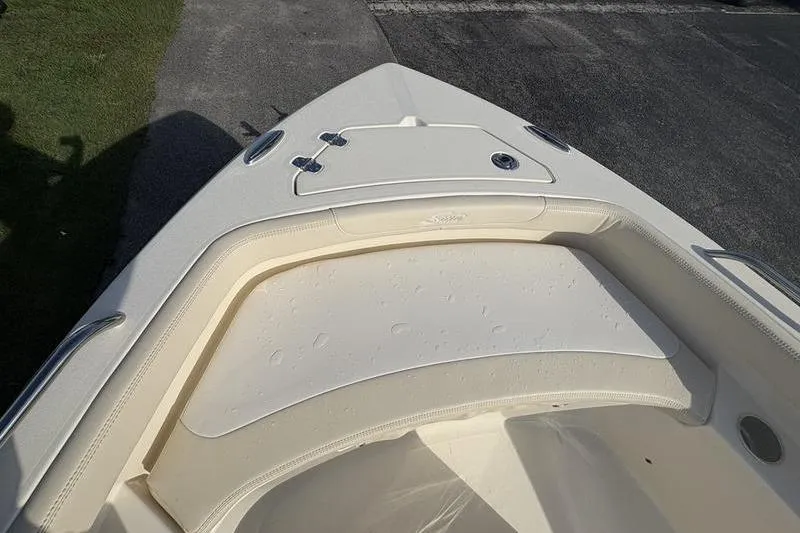 Slide: The Image of 2026 Scout 188 Sportfish boat bow with seating and storage compartments. - 25