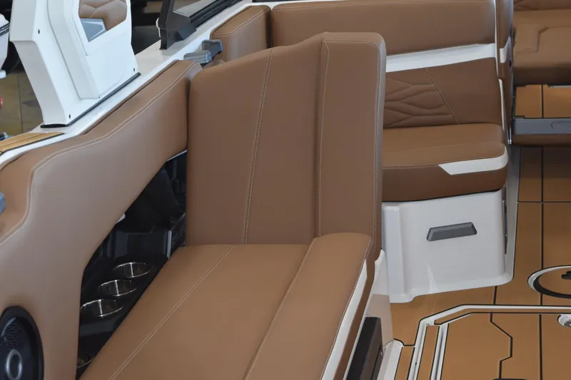 Slide: The Image of 2025 Supra SL boat interior with brown leather seating and modern design elements. - 10