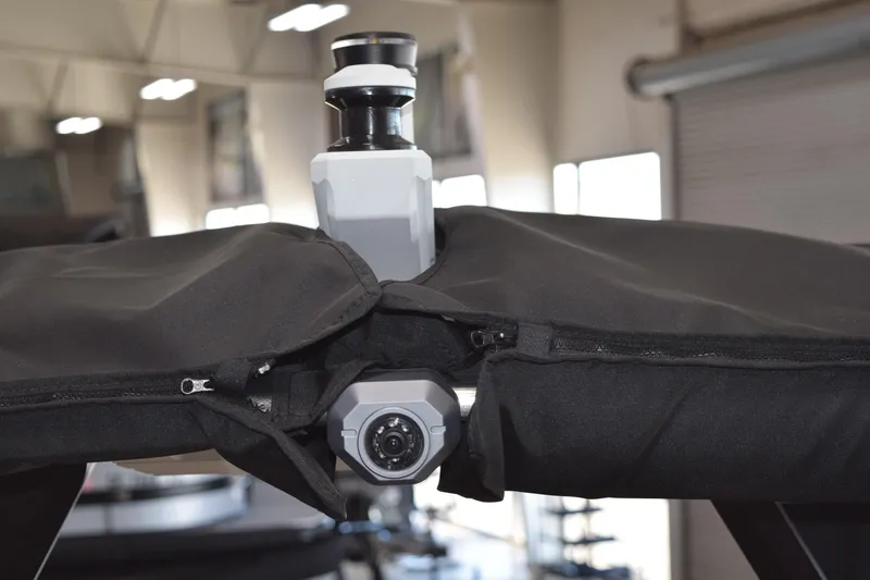 Slide: The Image of 2025 Supra SL boat camera system with protective cover in a showroom setting. - 16