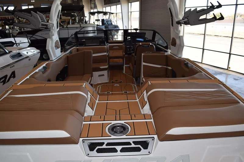 Slide: The Image of 2025 Supra SL boat interior with brown leather seating and modern design. - 2