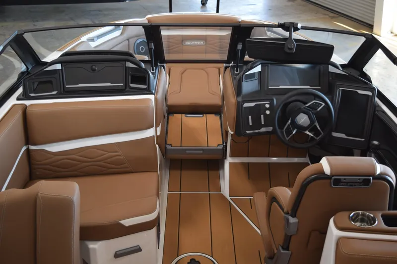 Slide: The Image of 2025 Supra SL boat interior with luxurious brown leather seating and modern dashboard design. - 4