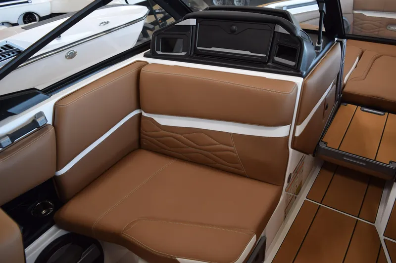 Slide: The Image of 2025 Supra SL boat interior with brown leather seating and modern design. - 6