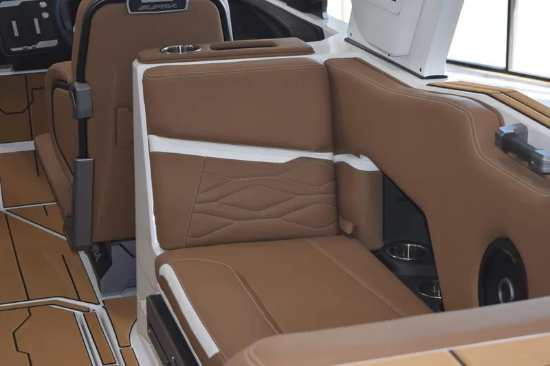 Slide: The Image of 2025 Supra SL boat interior with brown leather seating and modern design elements. - 7