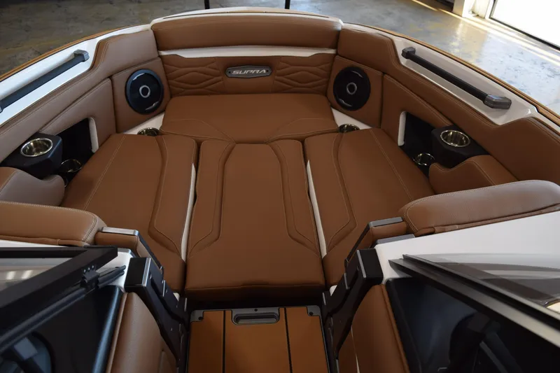 Slide: The Image of Luxurious interior of 2025 Supra SL boat with brown leather seating and cup holders. - 8