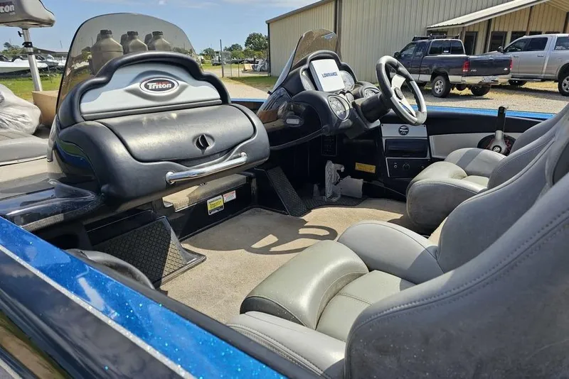 Slide: The Image of 2007 Triton 21 X-2 DEMO boat on trailer, parked outdoors. - 1