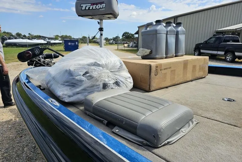 Slide: The Image of 2007 Triton 21 X-2 DEMO boat deck with supplies and equipment. - 12