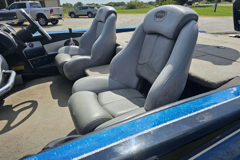 Slide: The Image of 2007 Triton 21 X-2 DEMO boat interior with gray seats and steering wheel. - 4
