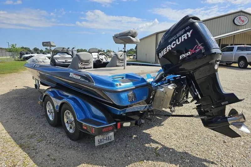 Slide: The Image of 2007 Triton 21 X-2 DEMO boat with Mercury Pro XS engine on trailer. - 5
