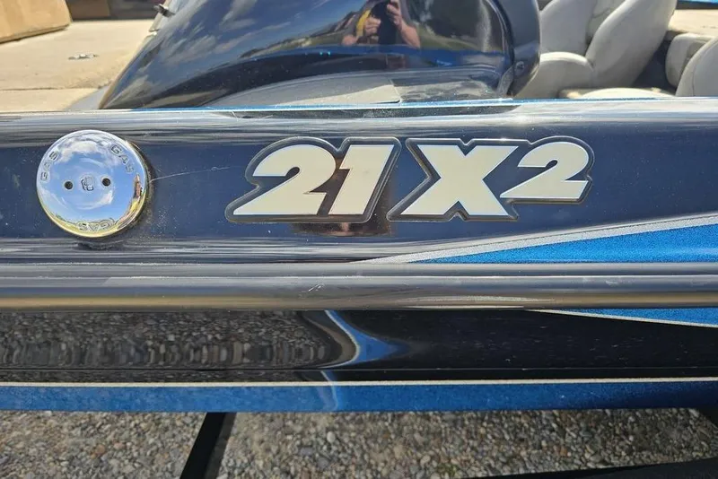 Slide: The Image of 2007 Triton 21 X-2 DEMO boat with blue and silver detailing. - 6