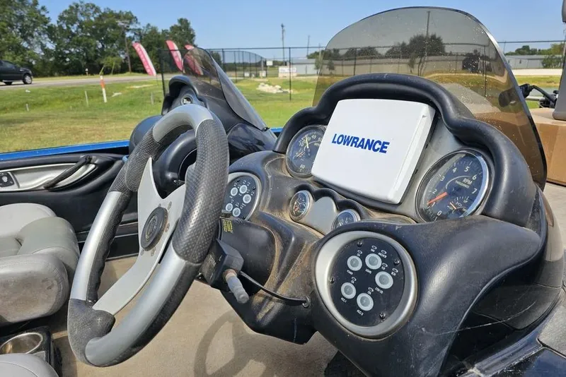 Slide: The Image of 2007 Triton 21 X-2 DEMO boat dashboard with Lowrance GPS and steering wheel. - 9