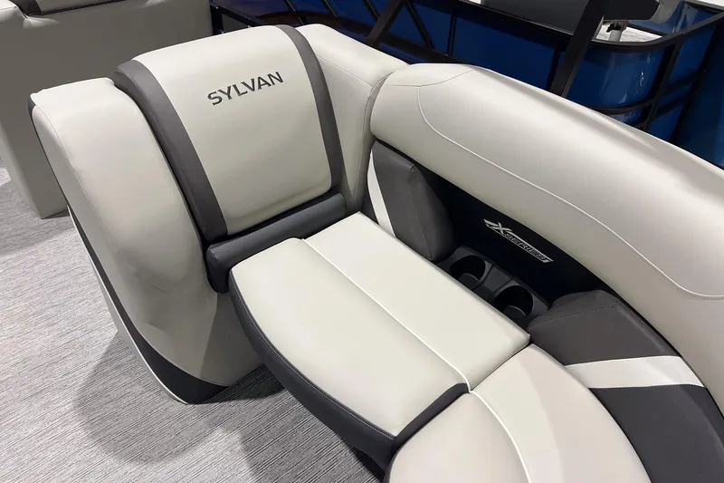 Slide: The Image of 2025 Sylvan Mirage X X3 CLZ boat interior with luxurious seating and cup holders. - 18