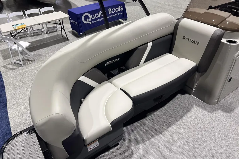 Slide: The Image of 2025 Sylvan Mirage X X3 CLZ boat interior with curved seating and modern design. - 20