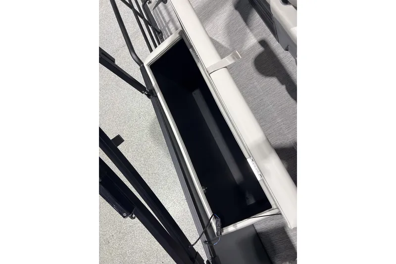 Slide: The Image of 2025 Sylvan Mirage X X3 CLZ boat storage compartment, open and empty. - 22