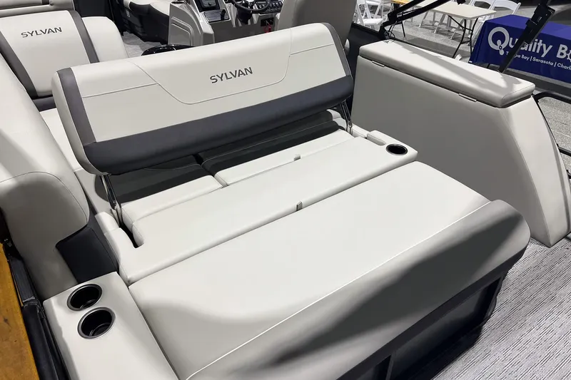 Slide: The Image of 2025 Sylvan Mirage X X3 CLZ boat interior with luxurious seating and cup holders. - 24