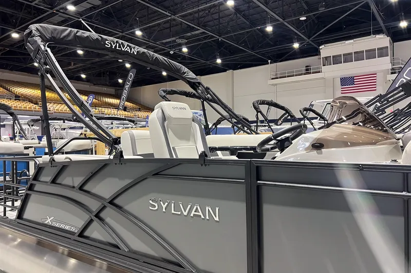 Slide: The Image of 2025 Sylvan Mirage X X3 CLZ pontoon boat displayed indoors. - 4
