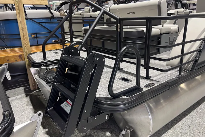 Slide: The Image of 2025 Sylvan Mirage X X3 CLZ pontoon boat with ladder and seating area. - 5