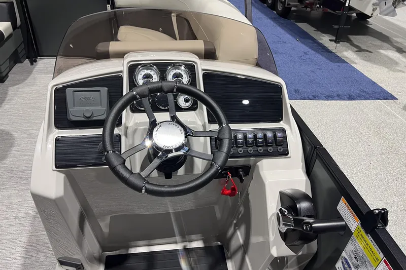 Slide: The Image of 2025 Sylvan Mirage X X3 CLZ boat dashboard with steering wheel and control panel. - 8