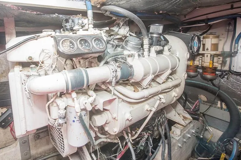 Slide: The Image of Engine room of 1998 Sea Ray 500 Sundancer yacht, showcasing detailed machinery and components. - 17