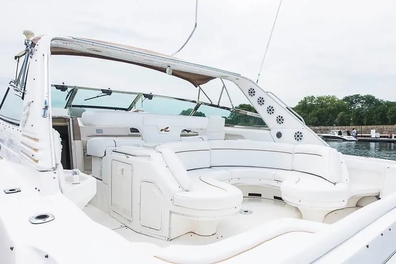Slide: The Image of 1998 Sea Ray 500 Sundancer yacht with spacious white seating area. - 4