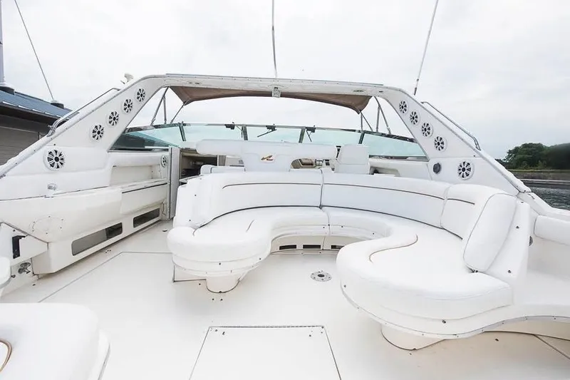 Slide: The Image of 1998 Sea Ray 500 Sundancer yacht with spacious white seating area and open deck. - 5