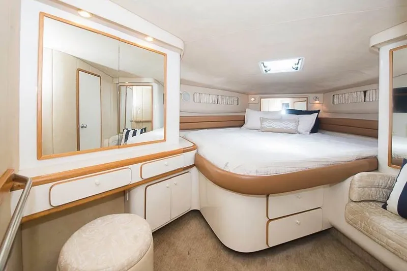 Slide: The Image of Luxurious cabin interior of 1998 Sea Ray 500 Sundancer yacht with elegant furnishings. - 9