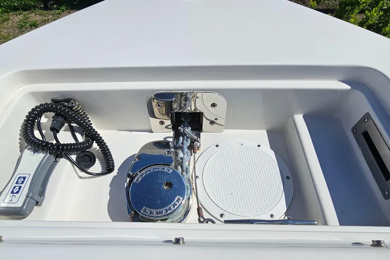Slide: The Image of 2019 Sailfish 275 DC boat anchor compartment with winch and control panel. - 31
