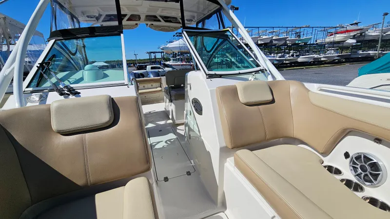 Slide: The Image of 2019 Sailfish 275 DC boat interior with beige seating and modern design. - 35