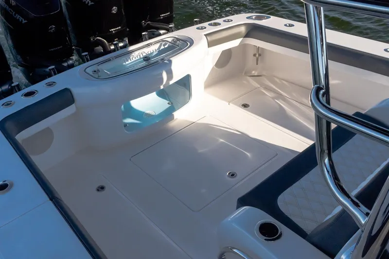 Slide: The Image of 2026 Mag Bay 43 CC boat deck with seating and storage compartments. - 12