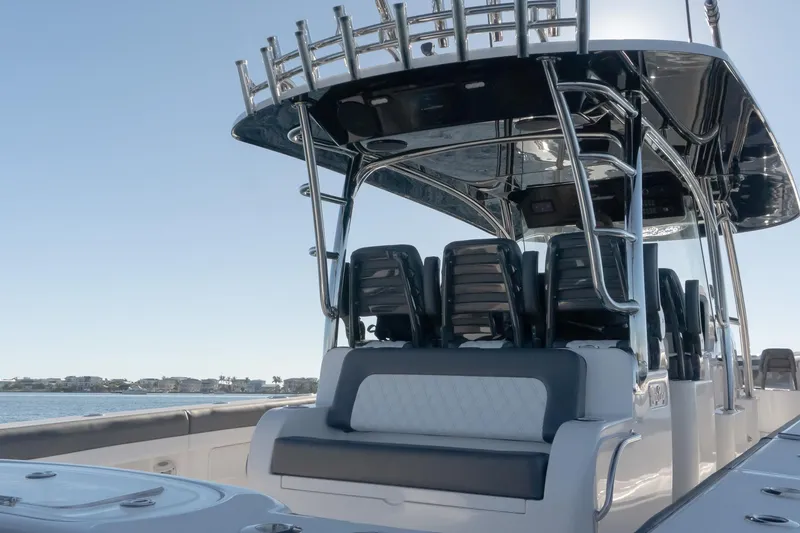 Slide: The Image of 2026 Mag Bay 43 CC boat with sleek seating and modern design on the water. - 13