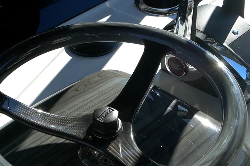Slide: The Image of Steering wheel of 2026 Mag Bay 43 CC boat, featuring sleek design and modern controls. - 21