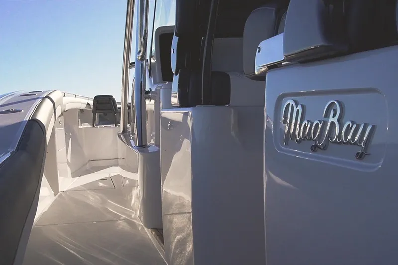 Slide: The Image of 2026 Mag Bay 43 CC boat interior with sleek design and logo detail. - 26