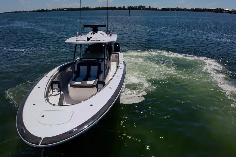 Slide: The Image of 2026 Mag Bay 43 CC boat cruising on open water. - 29