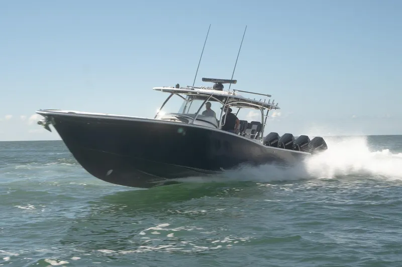 Slide: The Image of 2026 Mag Bay 43 CC boat cruising on open water. - 4