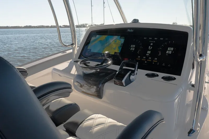 Slide: The Image of Helm of 2026 Mag Bay 43 CC boat with advanced navigation displays. - 6