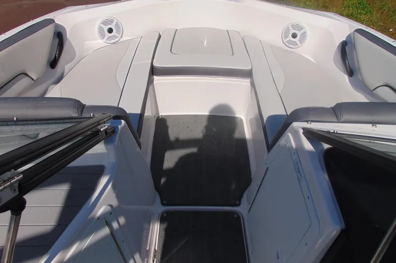 Slide: The Image of 2023 Yamaha Boats AR190 interior with seating and storage compartments. - 11