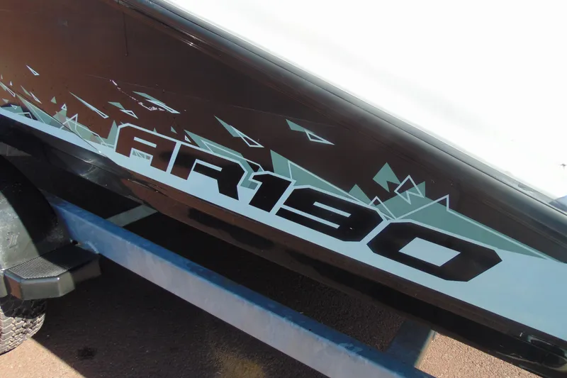 Slide: The Image of 2023 Yamaha Boats AR190 side view with bold graphics on trailer. - 6