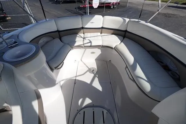 Slide: The Image of 2004 Four Winns 245 Sundowner boat interior with spacious seating and sleek design. - 11