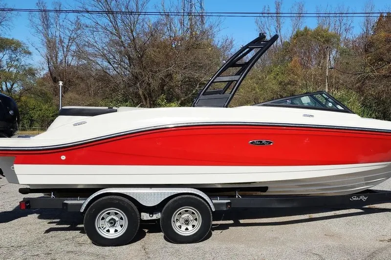 Slide: The Image of 2021 Sea Ray SPX 210 Outboard boat on trailer, red and white design. - 2