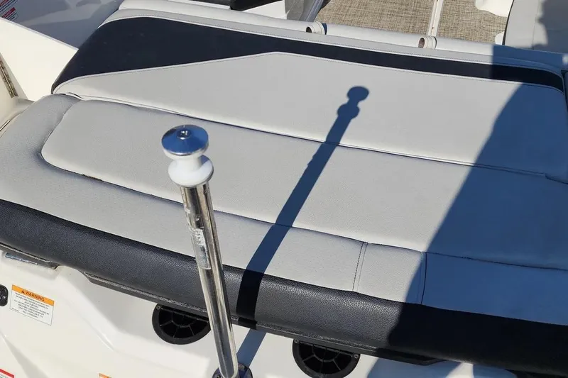 Slide: The Image of 2021 Sea Ray SPX 210 Outboard boat seat with black and white upholstery. - 25