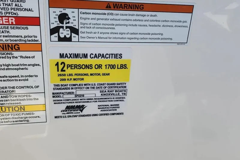 Slide: The Image of Warning label on 2021 Sea Ray SPX 210 Outboard, capacity: 12 persons or 1700 lbs. - 26