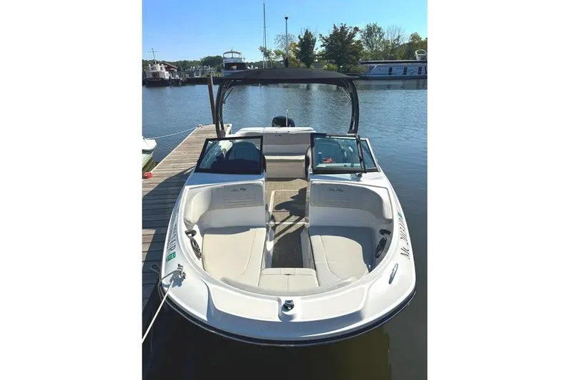 Slide: The Image of 2021 Sea Ray SPX 210 Outboard boat docked on a sunny day. - 5