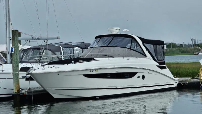Slide: The Image of 2014 Sea Ray 350 Sundancer yacht docked at marina. - 0