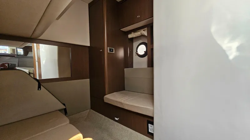 Slide: The Image of Interior of 2014 Sea Ray 350 Sundancer, featuring cozy seating and modern design. - 23