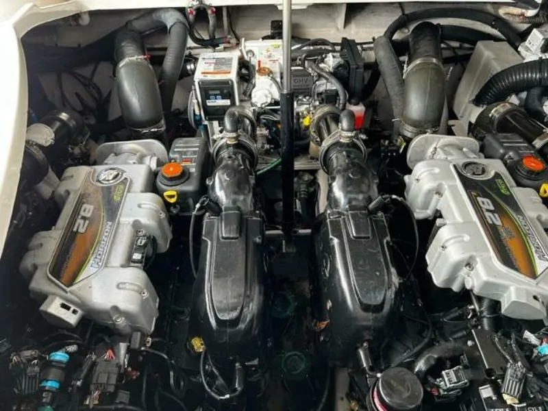 Slide: The Image of Engine compartment of a 2014 Sea Ray 350 Sundancer boat, showcasing dual engines. - 28