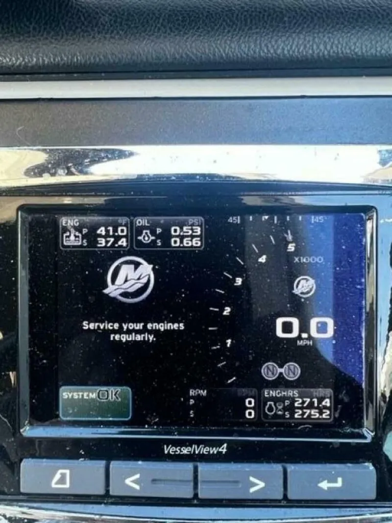 Slide: The Image of Dashboard display of a 2014 Sea Ray 350 Sundancer showing engine and oil metrics. - 29