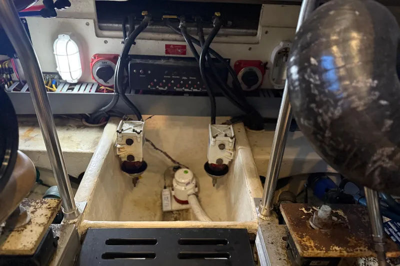 Slide: The Image of Engine compartment of 2005 Luhrs 38 Convertible boat, showing wiring and components. - 14