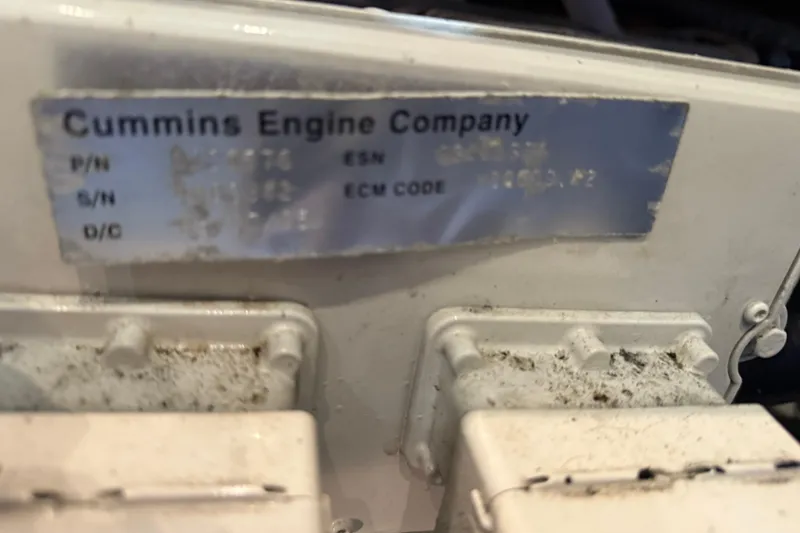 Slide: The Image of Cummins engine label on 2005 Luhrs 38 Convertible boat, showing part and serial numbers. - 15