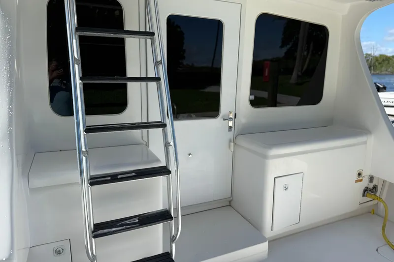 Slide: The Image of 2005 Luhrs 38 Convertible yacht with ladder and cabin door. - 16