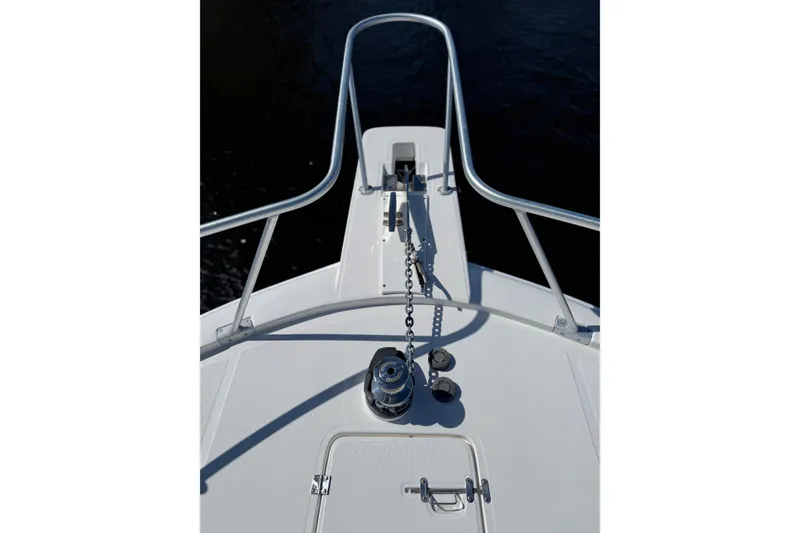 Slide: The Image of Bow view of 2005 Luhrs 38 Convertible boat with anchor chain and railing. - 17